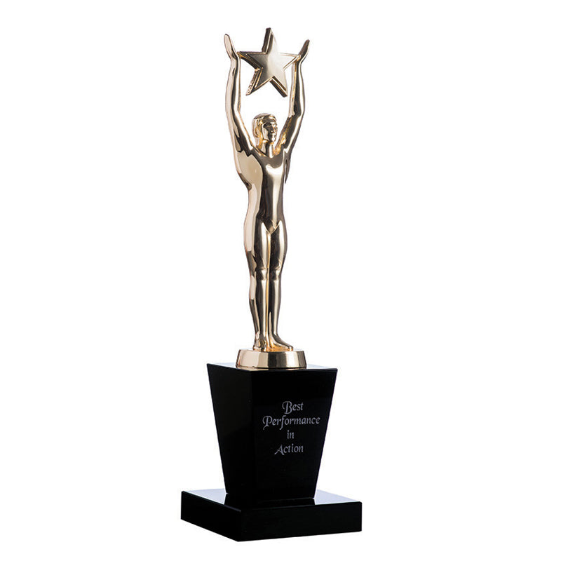 Gold oscar figurine with star on black crystal base